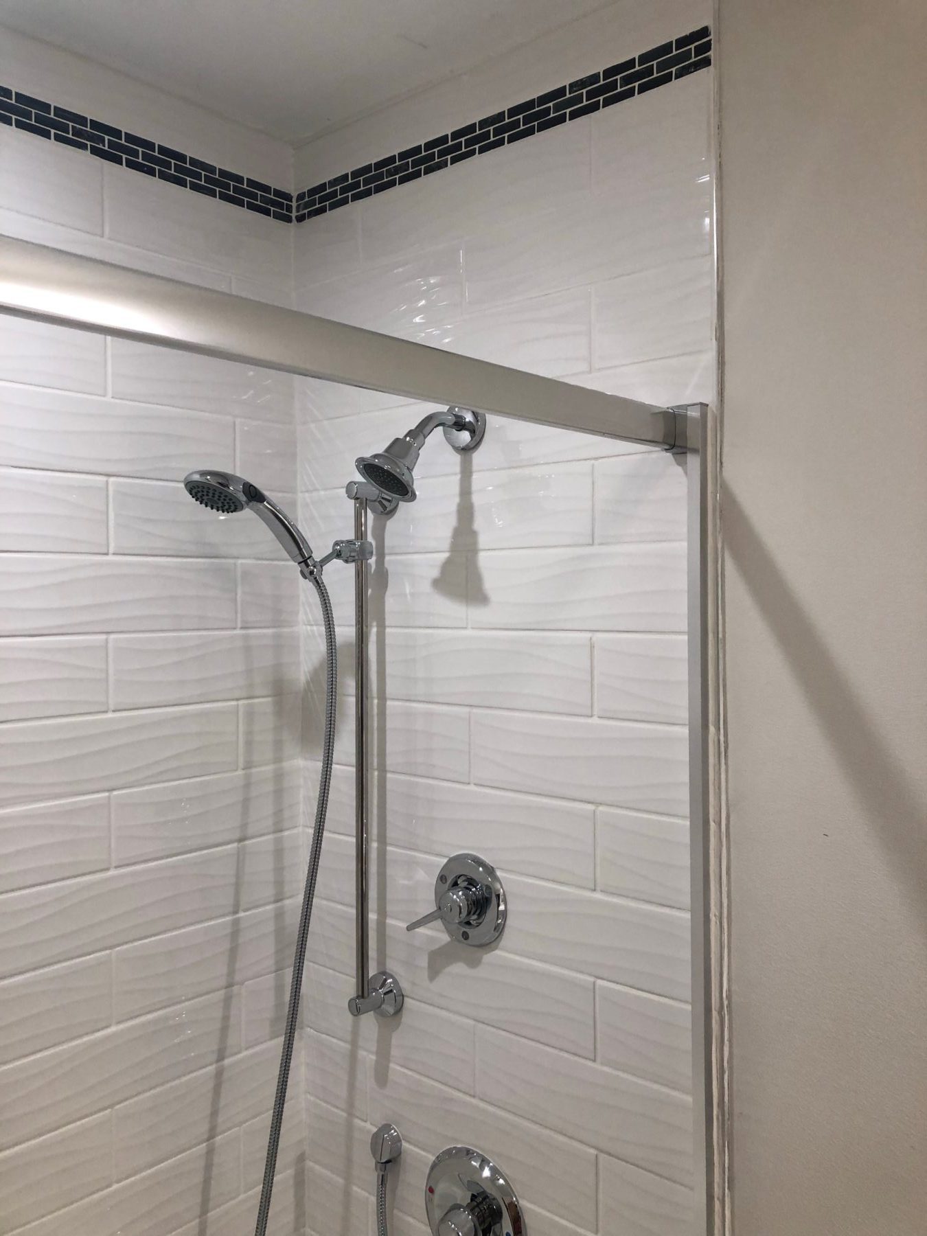 Read more about the article White tiled shower