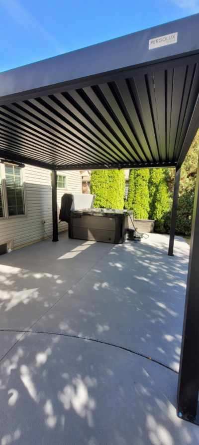 Concrete Patio with a Pergola and Hot Tub
